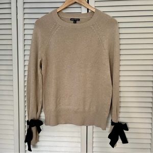 Women’s sweater with bow ties on sleeves